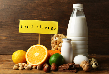 Allergy food concept. Allergic food on wooden backgroundの写真素材
