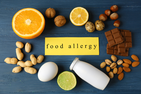 Allergy food concept. Allergic food on wooden backgroundの写真素材