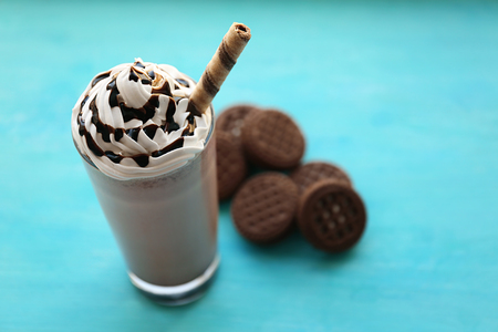 Delicious milkshake with cookies on wooden tableの写真素材