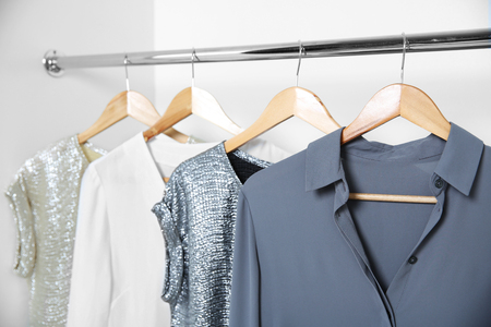 Female clothes hanging in wardrobeの写真素材