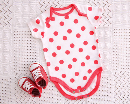 Baby clothes on fabric backgroundの写真素材