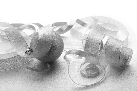 Christmas balls with ribbons on light textured backgroundの写真素材