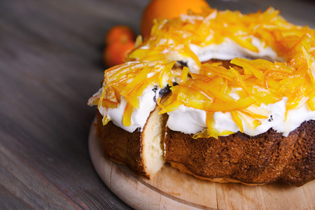 Delicious citrus cake on wooden backgroundの写真素材