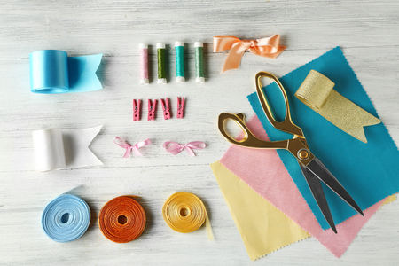 Sewing creative accessories on wooden background, top viewの写真素材