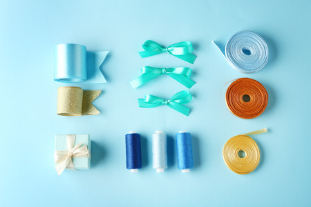 Sewing creative accessories on blue background, top viewの写真素材