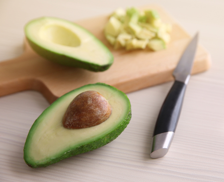 Fresh sliced avocado on cutting boardの写真素材