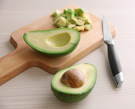 Fresh sliced avocado on cutting boardの写真素材