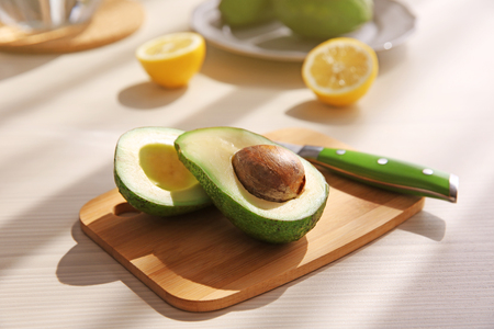 Fresh sliced avocado on cutting boardの写真素材