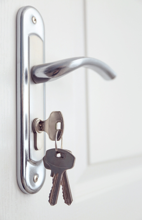 Metal door knob and keys closeupの写真素材