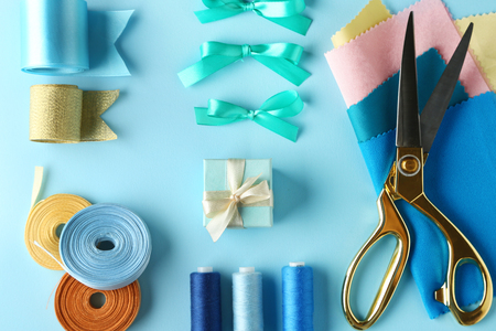 Sewing creative accessories on blue background, top viewの写真素材