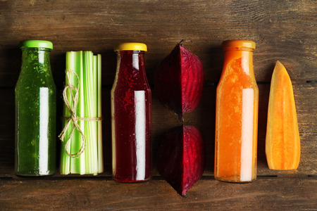 Fresh healthy smoothies on wooden backgroundの写真素材