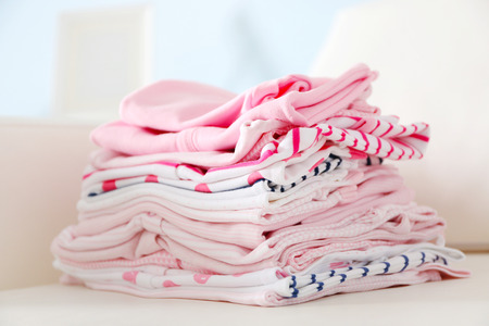 Pile of baby clothes, close upの写真素材