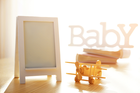 Child toy with frame on white wooden tableの写真素材