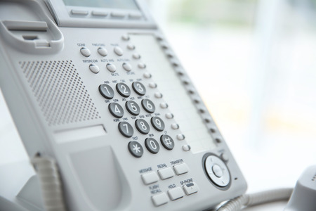 Office IP telephone on light backgroundの写真素材