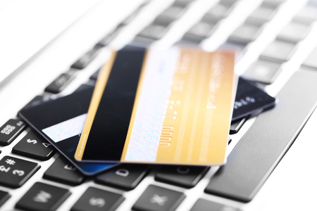 Credit cards on keyboard, closeupの写真素材