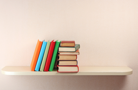 Many books on wooden shelfの写真素材