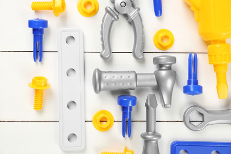 Toy set for child on wooden background