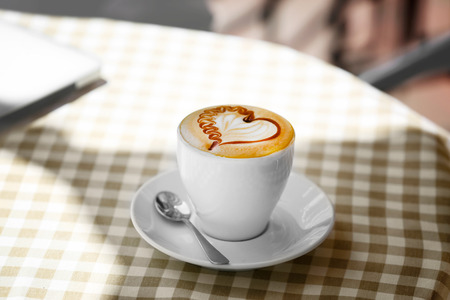 Cup of coffee with heart shape foamの写真素材