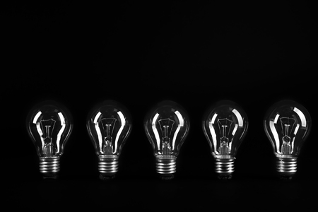 Electric bulbs on grey backgroundの写真素材