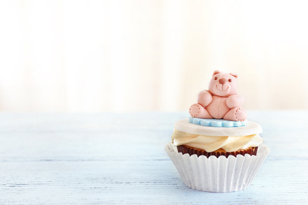 Delicious cupcake on light backgroundの写真素材