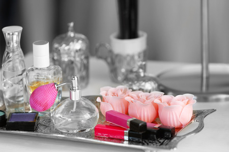 Cosmetic set on old silver tray