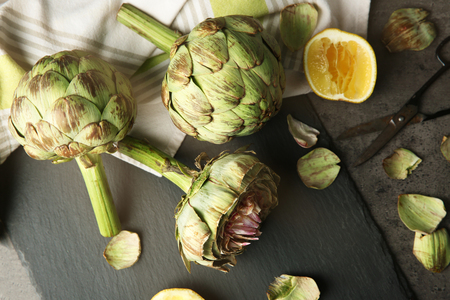 Artichokes on kitchen tableの写真素材