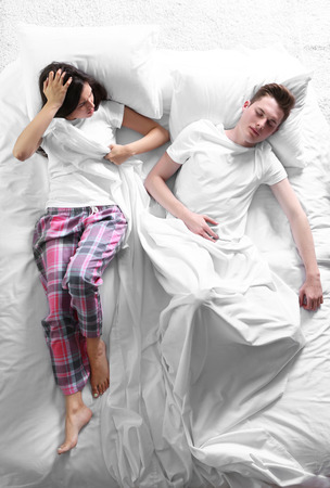Sleeping couple, top viewの写真素材