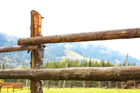 Wooden fence on mountain forest backgroundの写真素材