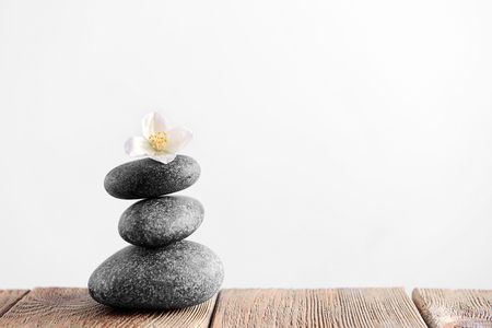Gray spa stones on light backgroundの写真素材
