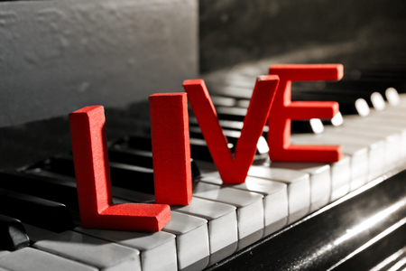 Word LIVE on piano keys, close upの写真素材