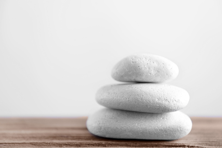 White spa stones on light backgroundの写真素材