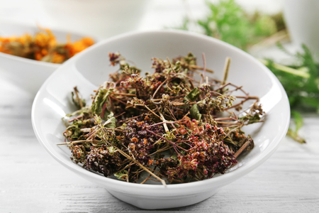 Natural flower and herb selection in ceramic bowl, close upの写真素材