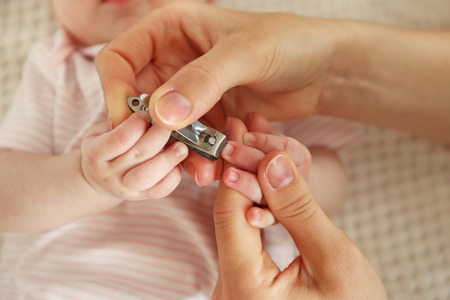 Cutting baby nails, closeupの写真素材