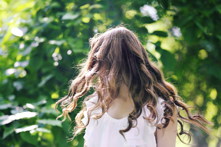 Beautiful girl relaxing in green parkの写真素材