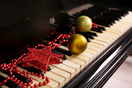 Christmas decoration on piano keys, closeupの写真素材