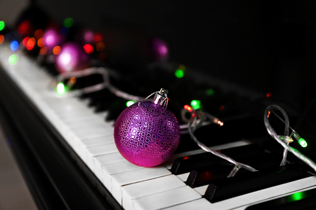 Christmas decoration on piano keys, closeupの写真素材
