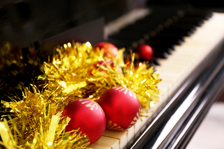 Christmas decoration on piano keys, closeupの写真素材