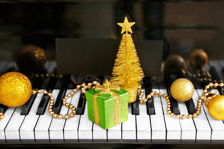 Christmas decoration on piano keys, closeupの写真素材