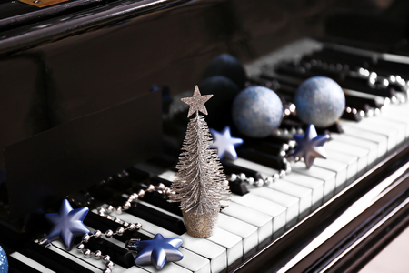 Christmas decoration on piano keys, closeupの写真素材