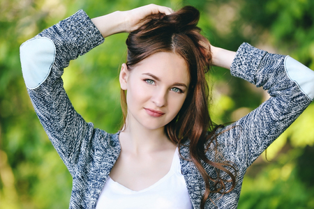 Portrait of beautiful girl in parkの写真素材