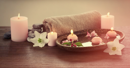 Spa composition with candles on blurred backgroundの写真素材