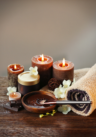 Spa chocolate set with candles on blurred backgroundの写真素材
