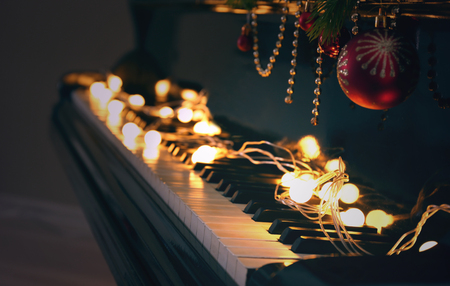 Piano keys with Christmas decorations, closeupの写真素材
