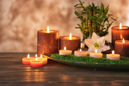 Spa composition with candles on blurred backgroundの写真素材