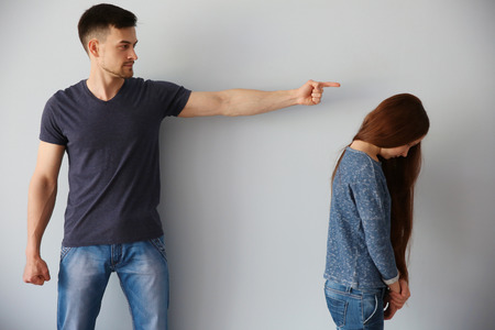 Family problems concept. Father punishing daughterの写真素材
