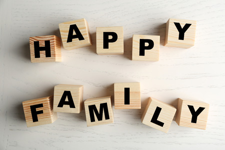 Words HAPPY FAMILY on light backgroundの写真素材