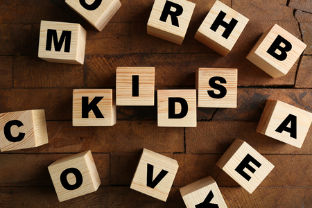 Word KIDS on wooden backgroundの写真素材