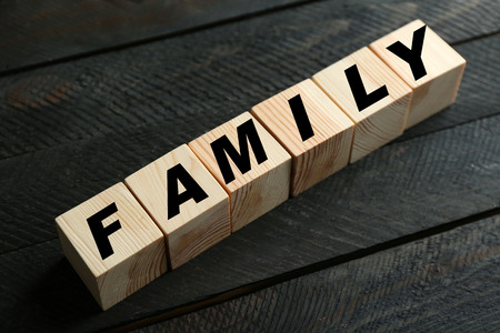 Word FAMILY on dark grey backgroundの写真素材