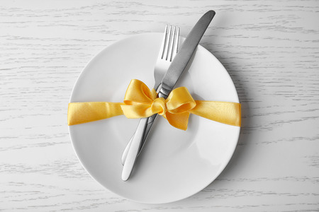 Beautiful table setting on white wooden tableの写真素材