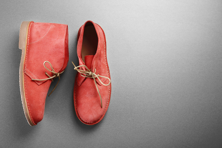 Red shoes on grey backgroundの写真素材